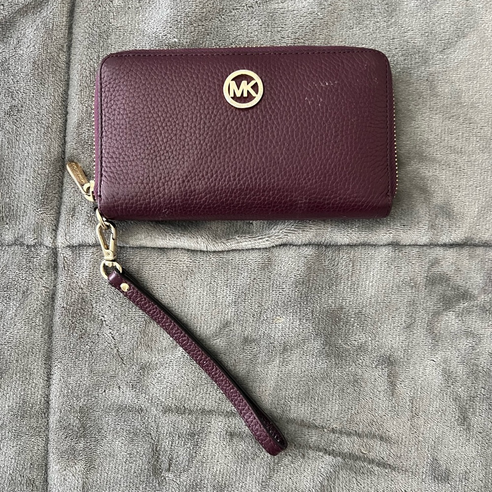 Michael Kors purple plum wristlet with minor blemish